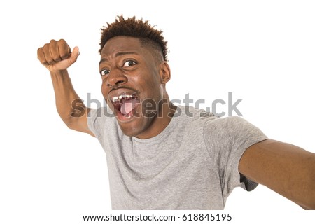 young afro american man smiling happy taking selfie self portrait picture with mobile phone looking excited having fun posing cool isolated in white background in communication technology concept