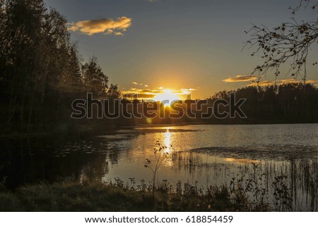 Sunset on the lake in the park of St. Petersburg