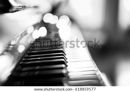 Piano keys in black and white with blurred background