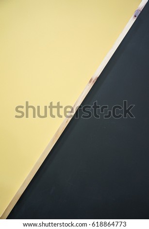yellow and black wall design with wood