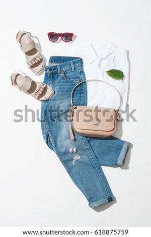 Full spring female look, sandals, jeans, handbag, shirt on white background