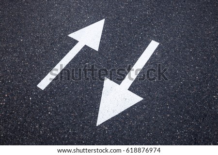 Direction sign on the asphalt road
