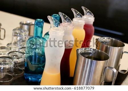 variety for fruit juices and water at a buffet counter