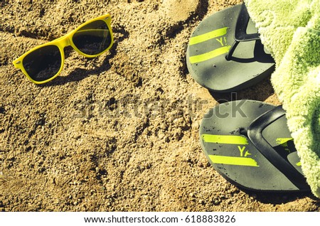 rest on beach with slippers and sunglasses/slippers and sunglasses on beach