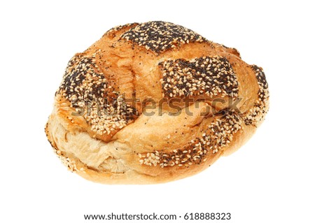 Rustic hand crafted poppy and sesame seeded bread loaf isolated against white