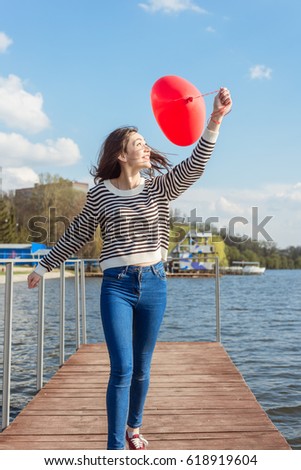 Portrait pretty happy smiling woman with air balloons heart shaped park outdoor.