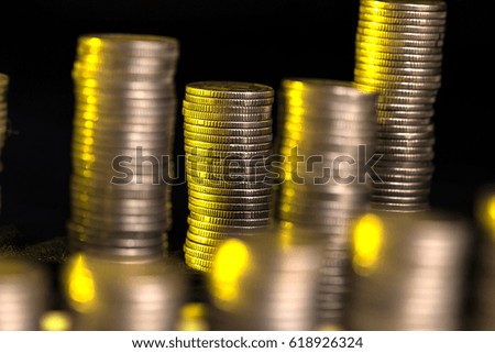 Stacks of coins with shallow depth of field as a symbol of business and banking.