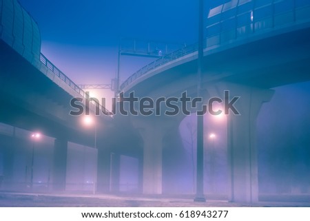 Crossing of Highways. Automotive interchanges. The road in the fog. Urban roads in the fog.