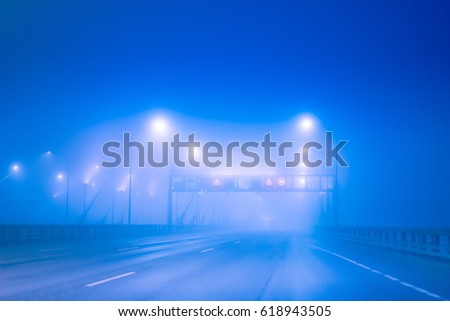 Highway in the fog. The road without cars.