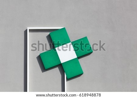 Pharmacy symbol on a wall