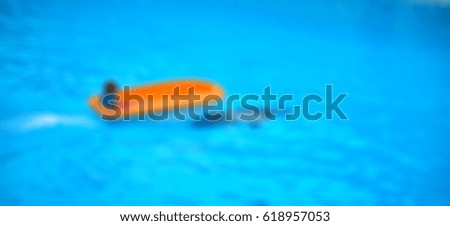 Picture blurred for background abstract and can be illustration Blurred Girl playing with on a dolphin