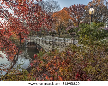 The Bow Bridge  is a cast iron bridge located in Central Park, New York City, crossing over The Lake in autumn