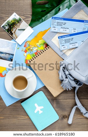 tourist lifestyle with tickets and passport wooden table background top view