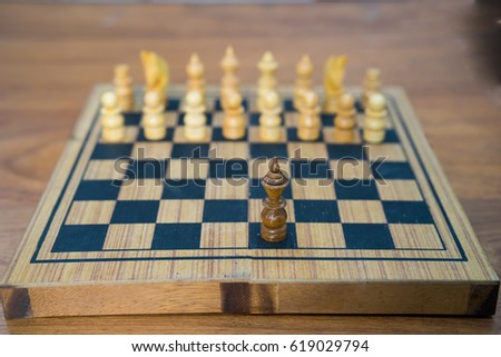 business concept of wooden chess Board and chess pieces on the table with one pawn left confronting the opposite side