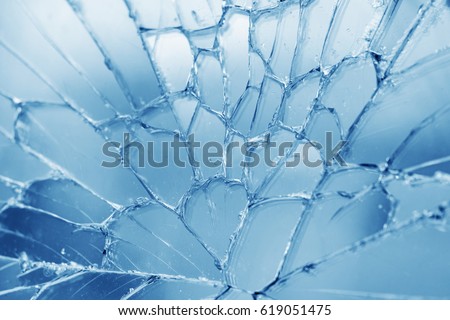 Broken blue glass with cracks, background, texture