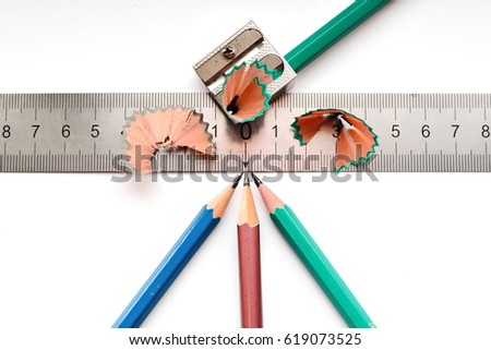 four pencil, sharpener, ruler and sliver on white isolated background