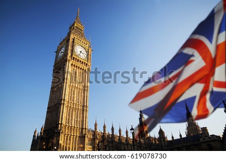 UK flag with Big Ben and House of Parliament in the background Royalty-Free Stock Photo #619078730