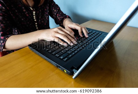 Woman office worker is typing keyboard, business technology and education concept, close up