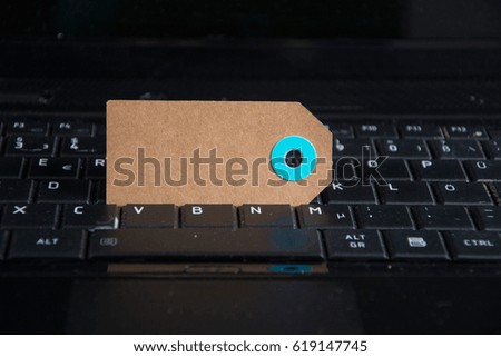 a paper tag on a keyboard