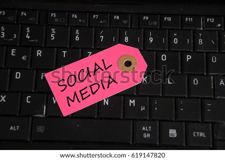 social media written on paper tag on a keyboard