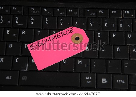 e-commerce written on paper tag on a keyboard