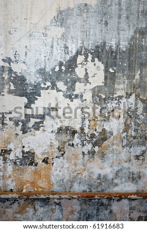 Old grungy wall texture. Peeling stained surface background. Royalty-Free Stock Photo #61916683