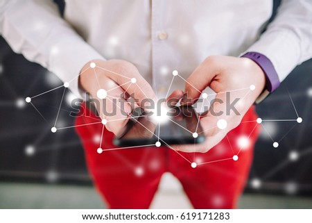 IOT - internet of things concept, man using a touchscreen smart phone. Man using smartphone with white data connection concept. Internet of things, future digital technology concept.