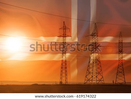High-voltage power transmission line. Energy pillars. At sunset, dawn. high-tension. Flag of Iceland