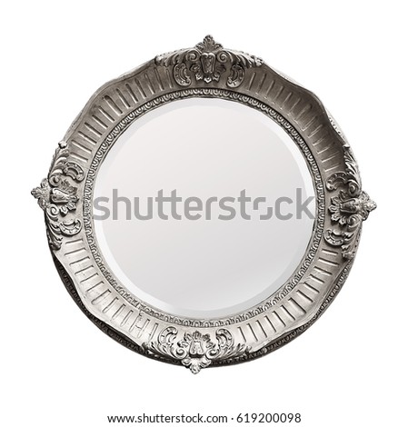 Mirror in a beautiful carved round silver frame