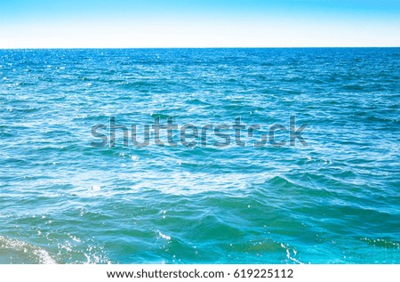 Bright blue water surface with small waves