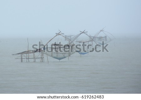 Giant fish trap net in rainy day
