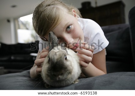 portrait of a girl with her rabbit pet