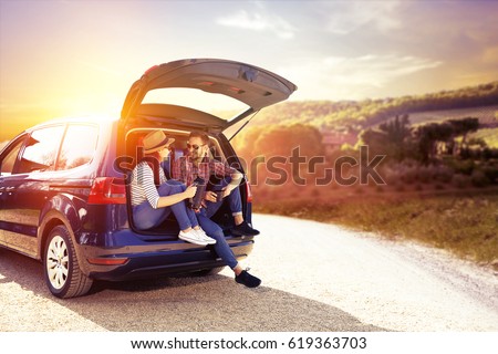 Car trip and two lovers  Royalty-Free Stock Photo #619363703