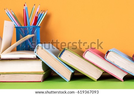 Open book, hardback books on bright colorful background. Back to school. Copy space for text