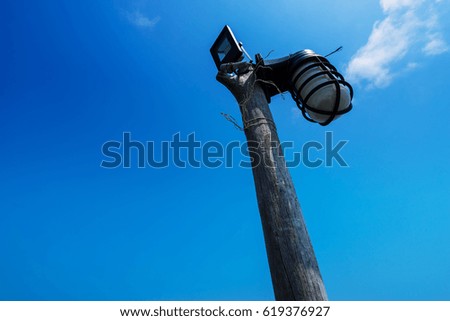 wood lighting electric on blue sky with cloud - can use to display or montage on product