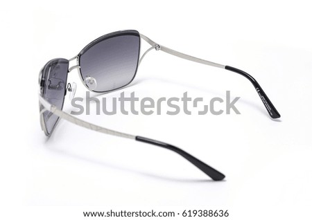 Sunglasses in an iron frame with brown glass isolated on white