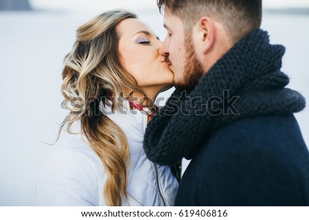Wedding winter, bride and groom walking at winter wedding day Royalty-Free Stock Photo #619406816
