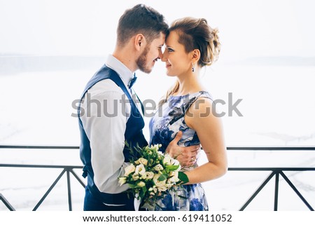 wedding in interior. Newlyweds kissing. Wedding photo shoot Royalty-Free Stock Photo #619411052
