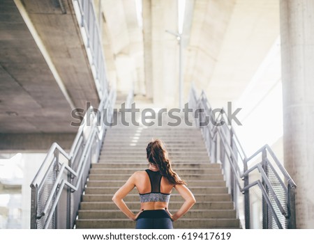 Sports woman preparing for a challenge  Royalty-Free Stock Photo #619417619