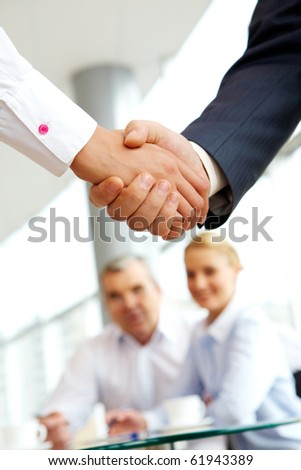 Vertical image of business agreement on the background of people
