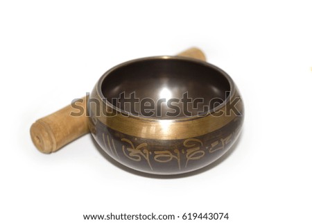 Photo of a singing bowl on white background..