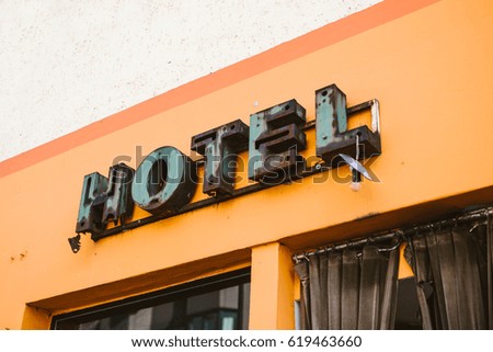Old rusty metal hotel sign
