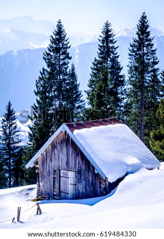 old house at the european alps in winter