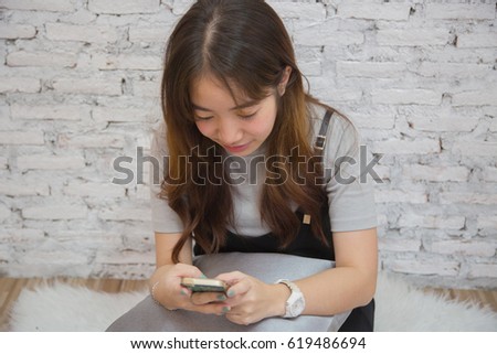 Young beautiful asian woman with smart phone, Young beautiful asian woman chat with boyfriend and smiling
