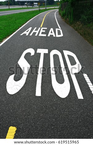 bicycle road with a sign of stop ahead