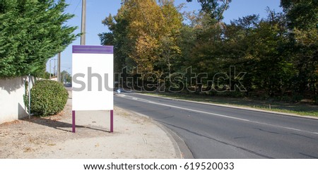 Urban sign on the edge of the road ready to receive your logo or advertising