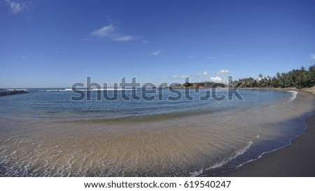 Beatiful beach at daytime with clear ocean