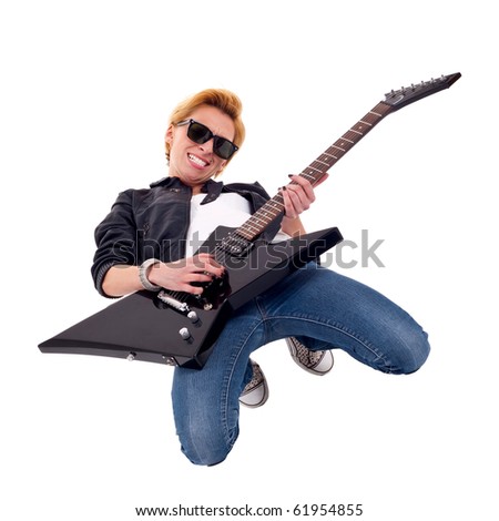 picture of a blond passionate woman guitarist playing on her knees