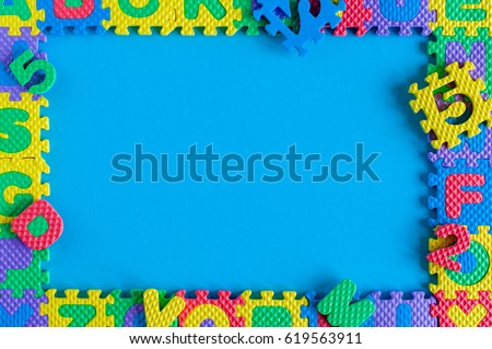 Image of simple poster frame of child toy puzzle. Mockup and template scene with blue background