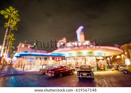 bokeh background of classic drive-in restaurants, american classic car parking outside, picture like a movies Royalty-Free Stock Photo #619567148